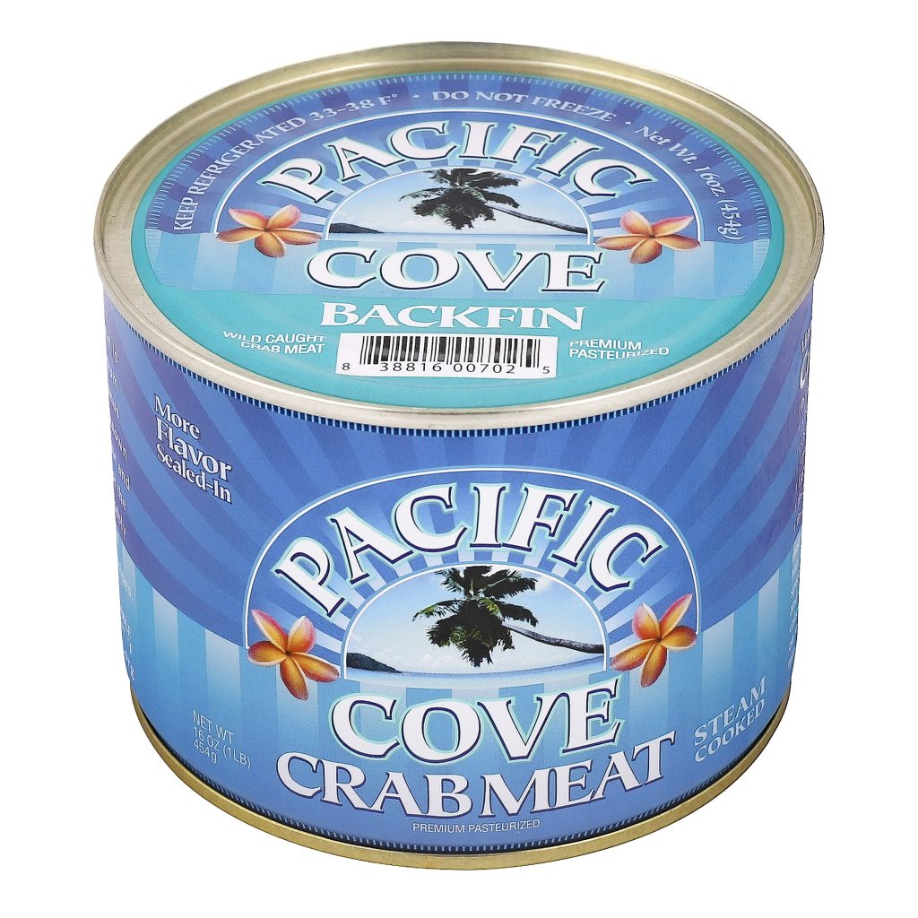 A can of Pacific Cove Backfin Crabmeat with a beach and palm tree design on the label.