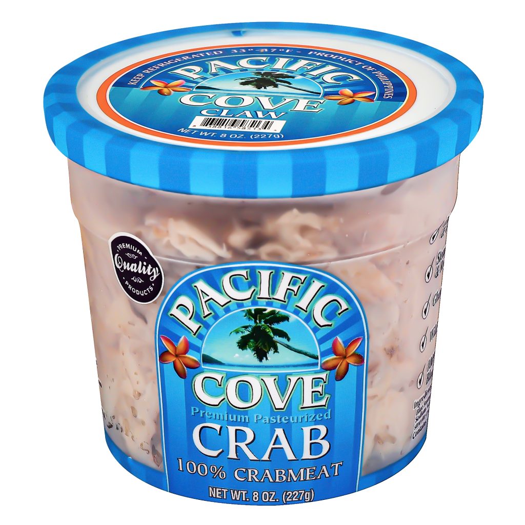 A container of Pacific Cove Crab 100% crabmeat, 8 oz, with a blue lid and tropical-themed label.