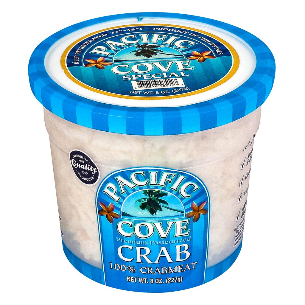 A blue-lidded container labeled "Pacific Cove Crab, 100% Crabmeat, 8 oz" with a palm tree logo.