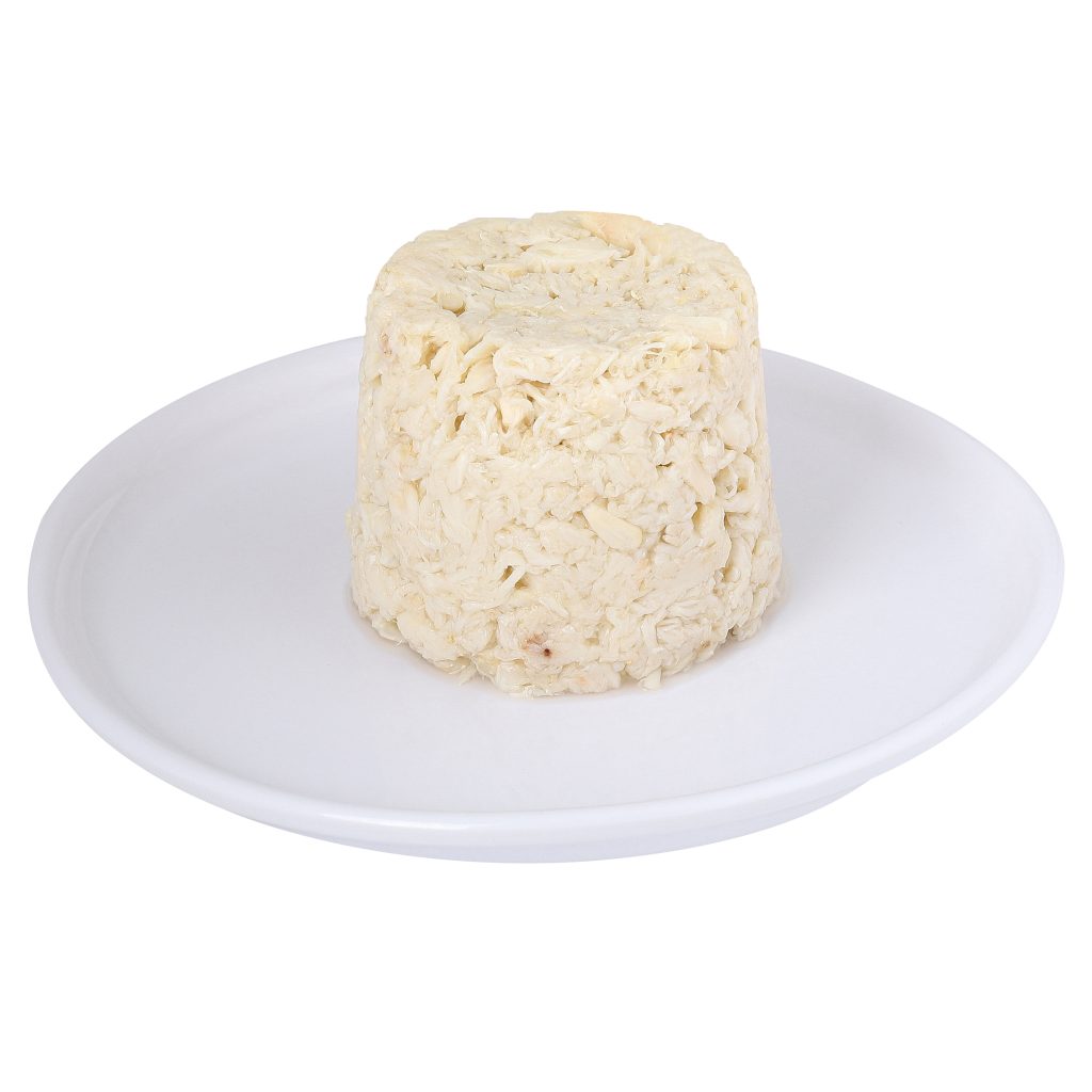A round block of uncooked instant ramen noodles on a white plate.